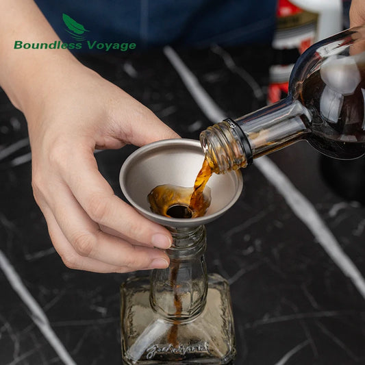 using-titanium-funnel-to-transfer-wine