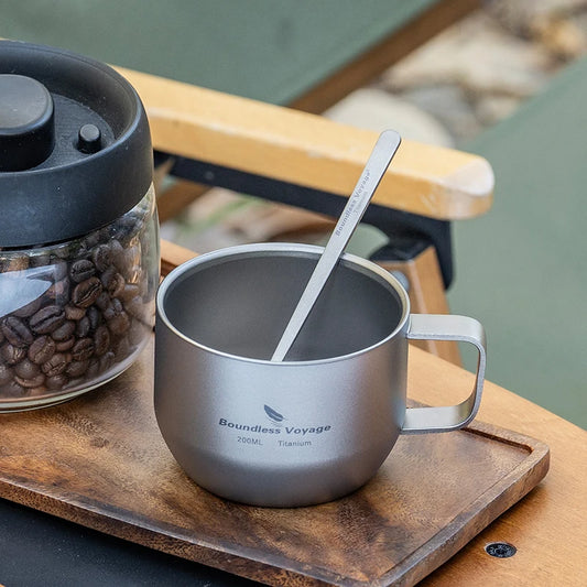 drinking-coffee-from-titanium-mug-at-campsite