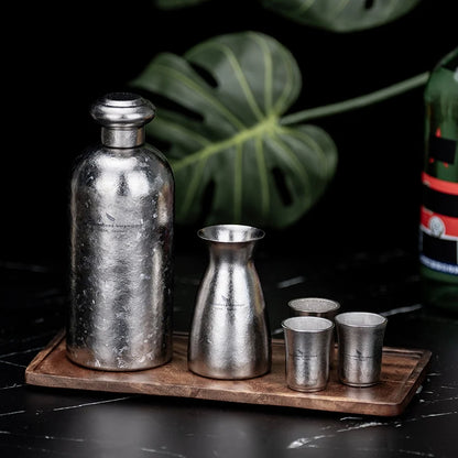 pouring-sake-from-titanium-decanter
