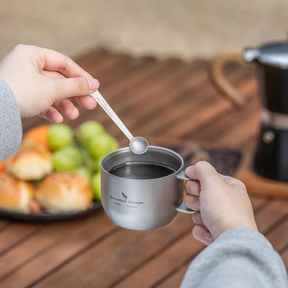 drinking-coffee-from-titanium-mug-at-campsite