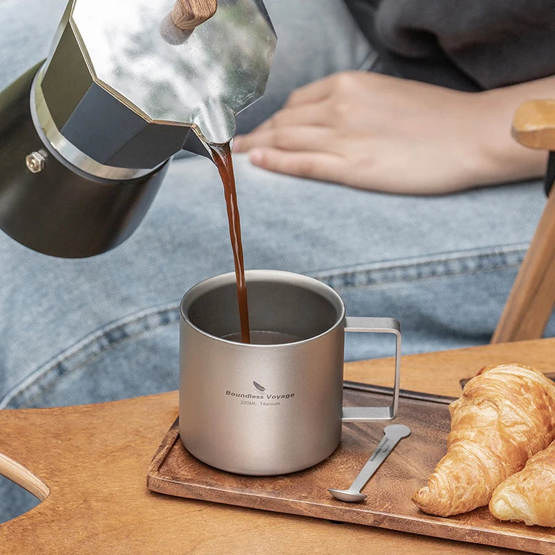 drinking-coffee-from-titanium-mug-at-campsite