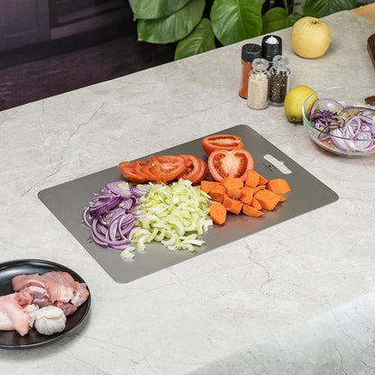 using-titanium-cutting-board-at-campsite-for-food-prep