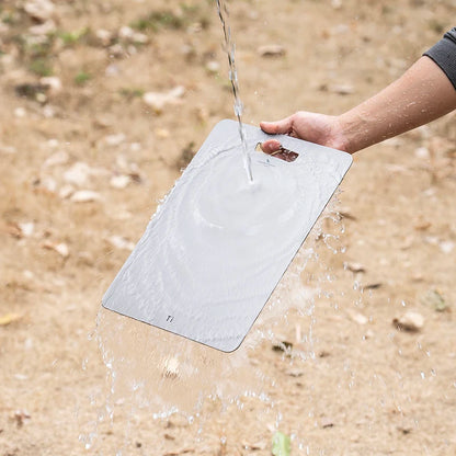 using-titanium-cutting-board-at-campsite-for-food-prep