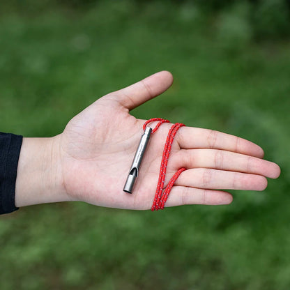 titanium-whistle-attached-to-backpack-for-hiking