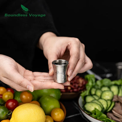 pouring-whiskey-into-titanium-shot-glass-at-home-bar