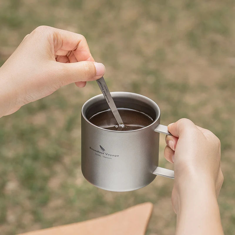 drinking-coffee-from-titanium-mug-at-campsite