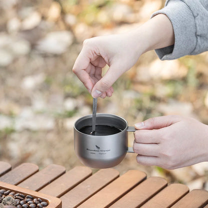 drinking-coffee-from-titanium-mug-at-campsite