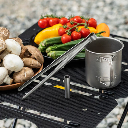 using-titanium-tongs-to-flip-meat-on-grill