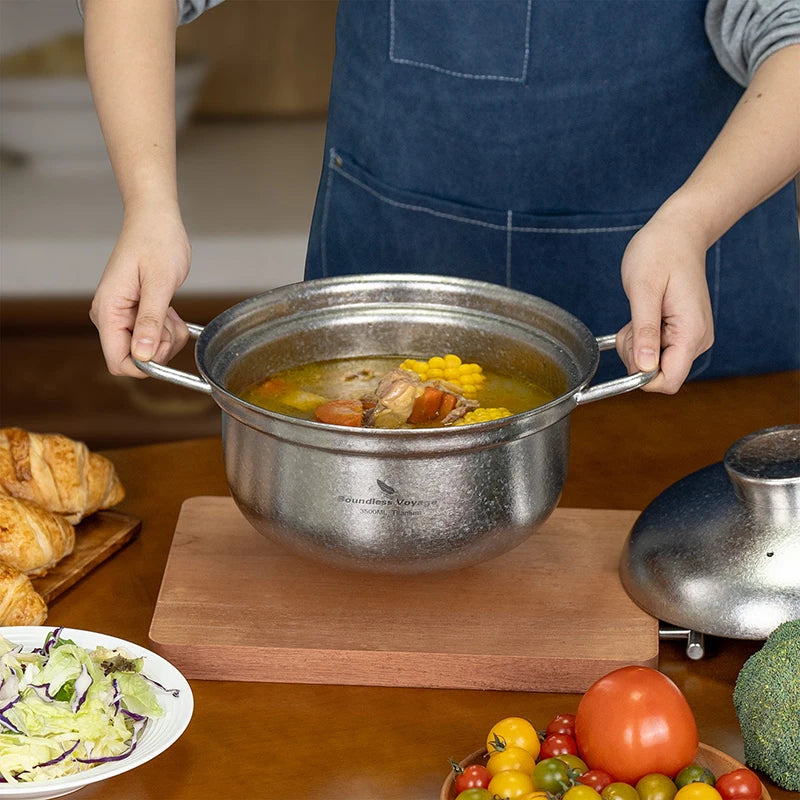 cooking-family-meal-in-large-titanium-soup-pot