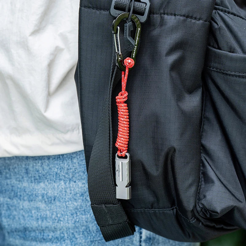 titanium-whistle-attached-to-backpack-for-hiking-safety