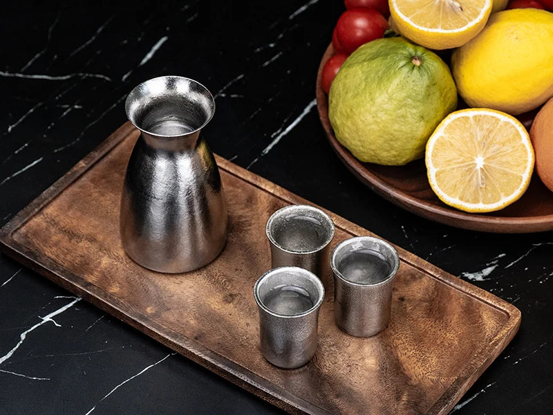 pouring-sake-from-titanium-decanter
