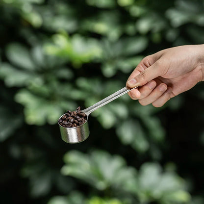 measuring-coffee-beans-with-titanium-scoop