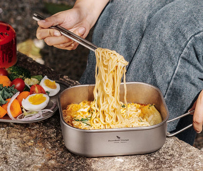 stove-safe-titanium-mess-tin-being-heated-on-campfire