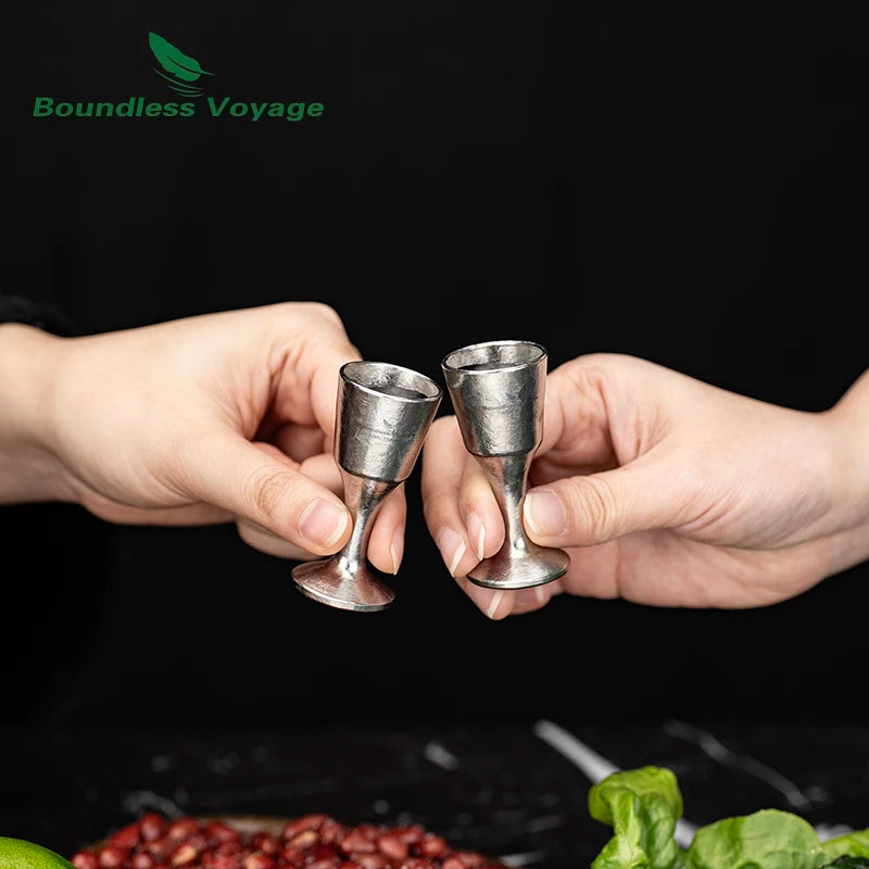 pouring-whiskey-into-titanium-shot-glass-at-home-bar