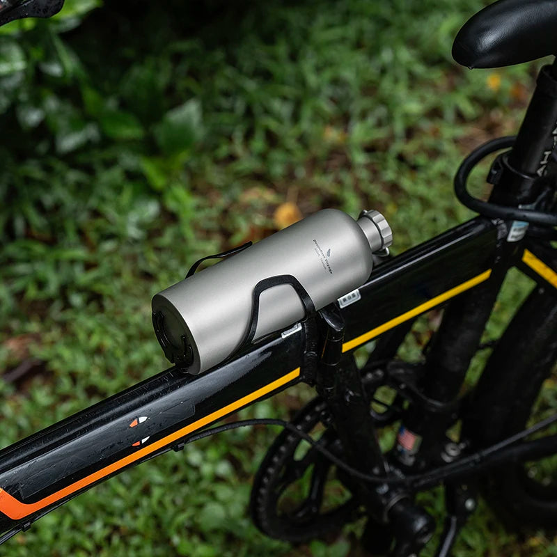 carrying-titanium-water-bottle-on-hiking-trail