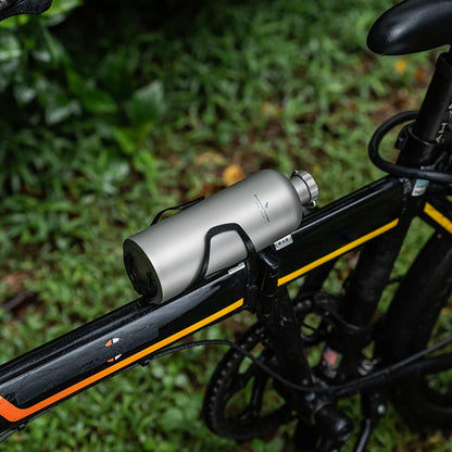 carrying-titanium-water-bottle-on-hiking-trail