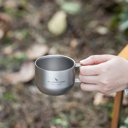 drinking-coffee-from-titanium-mug-at-campsite