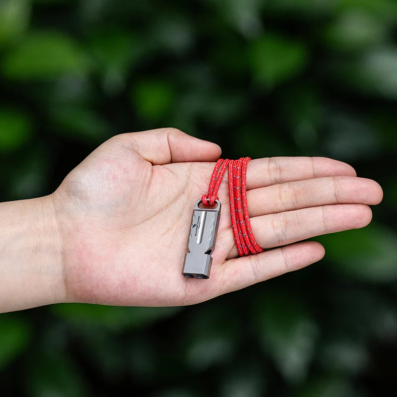 titanium-whistle-attached-to-backpack-for-hiking-safety