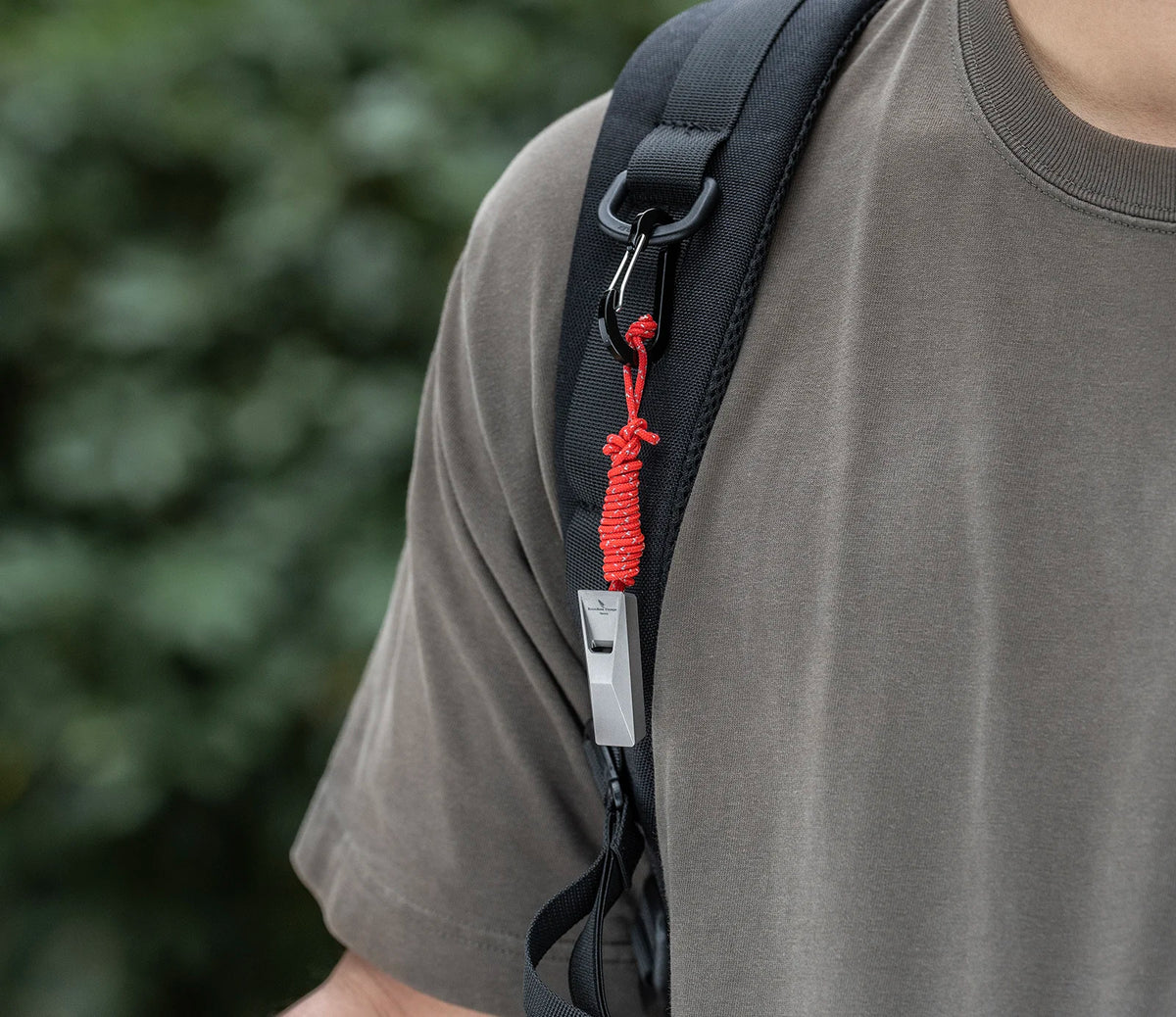 titanium-whistle-attached-to-backpack-for-hiking